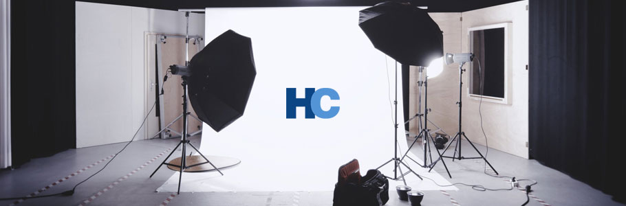 Harrison Camera logo with a studio background.