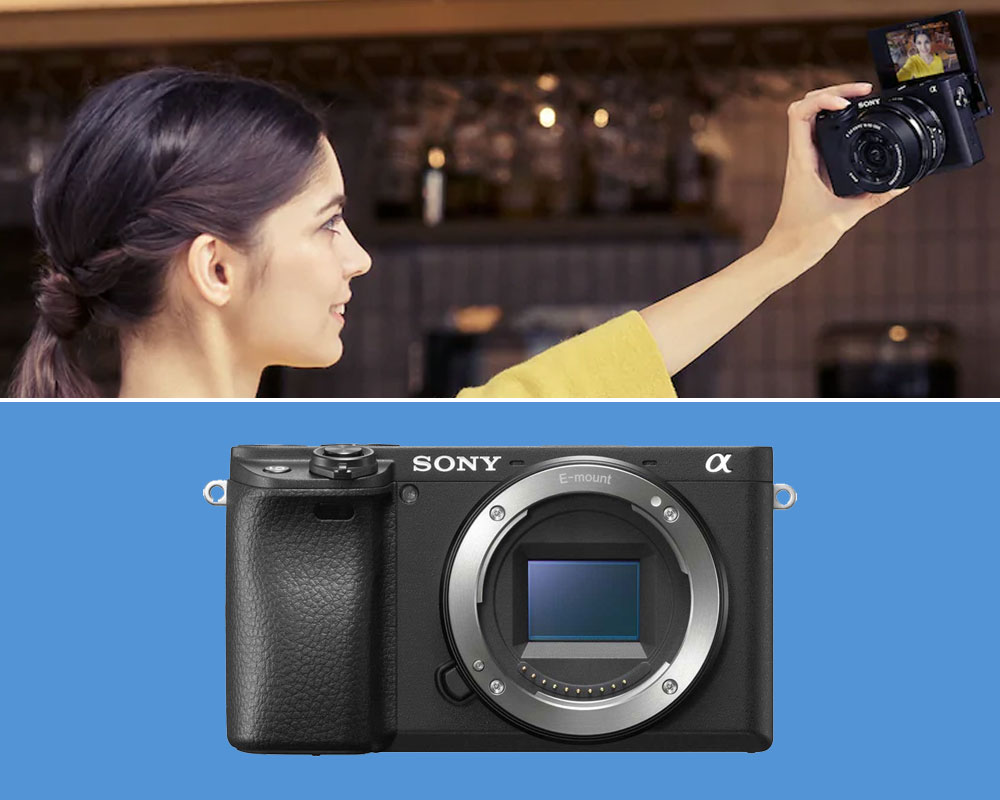 A woman taking a selfie with the Sony A6400.